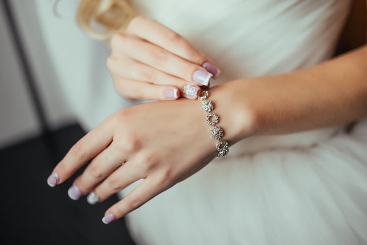 Wedding. Wedding day. Luxury bracelet on the bride's hand close-up Hands of the bride before wedding. Wedding accessories.
